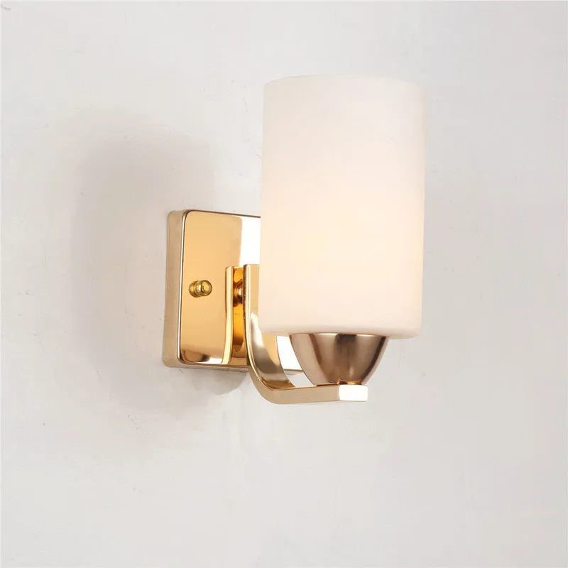 Chrome electroplated wall lamp with glass shade showing single head bedside lighting fixture