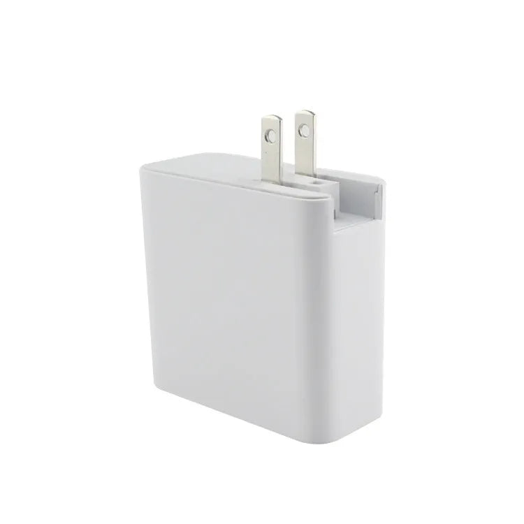 Black four-port USB-C wall charger with UK, EU, US, and AU plug adapters