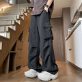 Plus size loose-fit waterproof straight-leg trousers in black on a hanger.