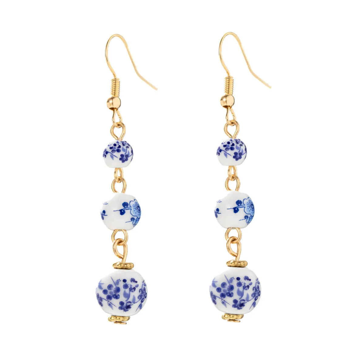Blue and white porcelain ceramic beads long drop earrings on display with geometric round shape and alloy backing