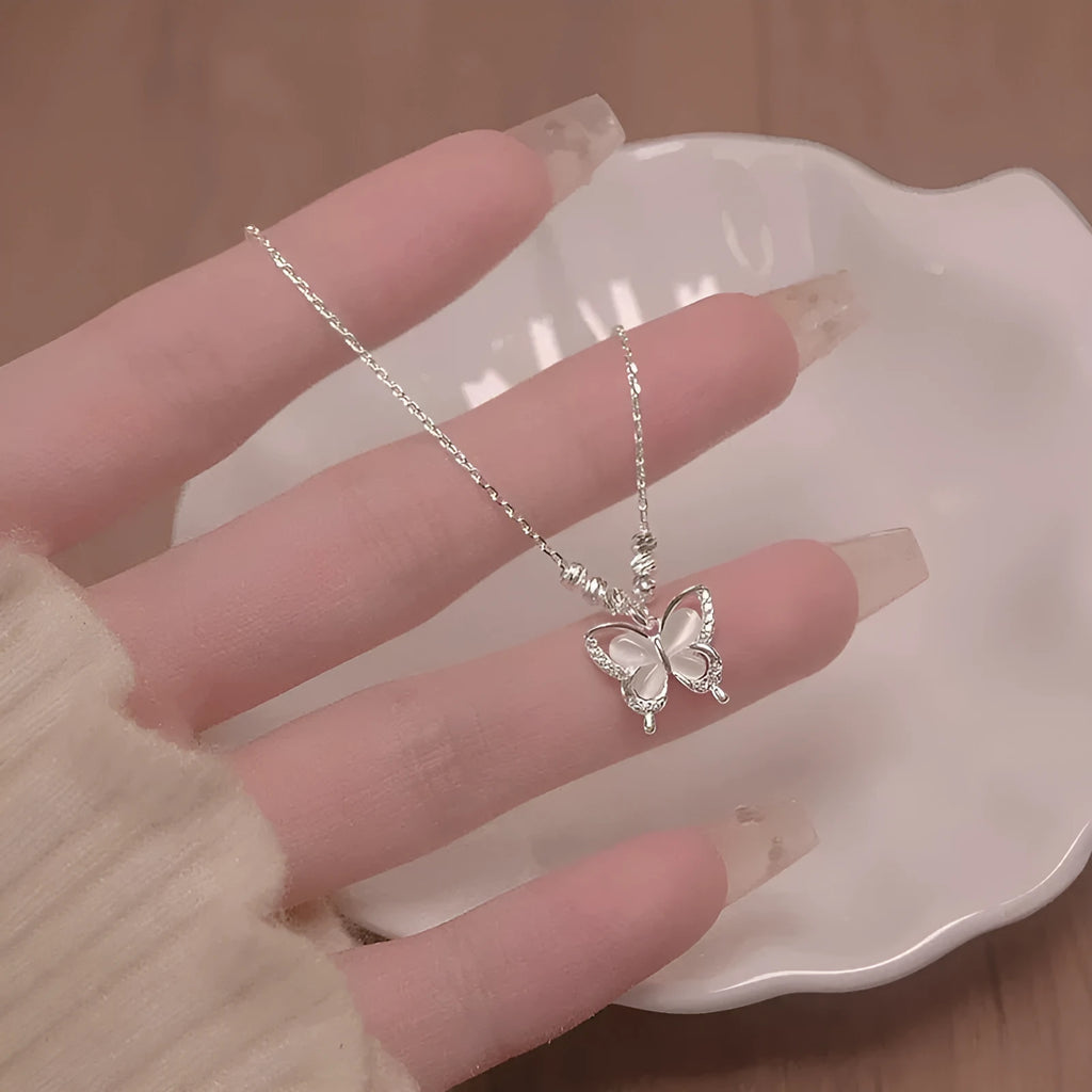 Women's silver necklace with opal butterfly charm on adjustable 925 sterling silver chain