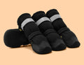 Extended medium large dog shoes with non-slip rubber sole in black waterproof style on a dog's paw