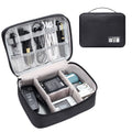 Black electronics organiser case open showing mesh pockets, elastic loops, and removable padded dividers for cable organisation