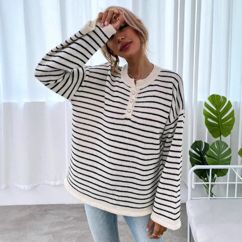 Black striped women's casual top with drop-shoulder sleeves and button detailing