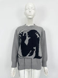 Women's loose alpaca wool tassel sweater in gray, round neck pullover style, side view on model