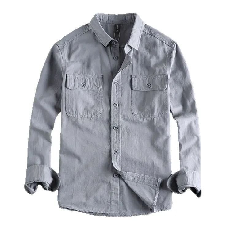 A man wearing a loose fit light grey long sleeve polyester cardigan shirt