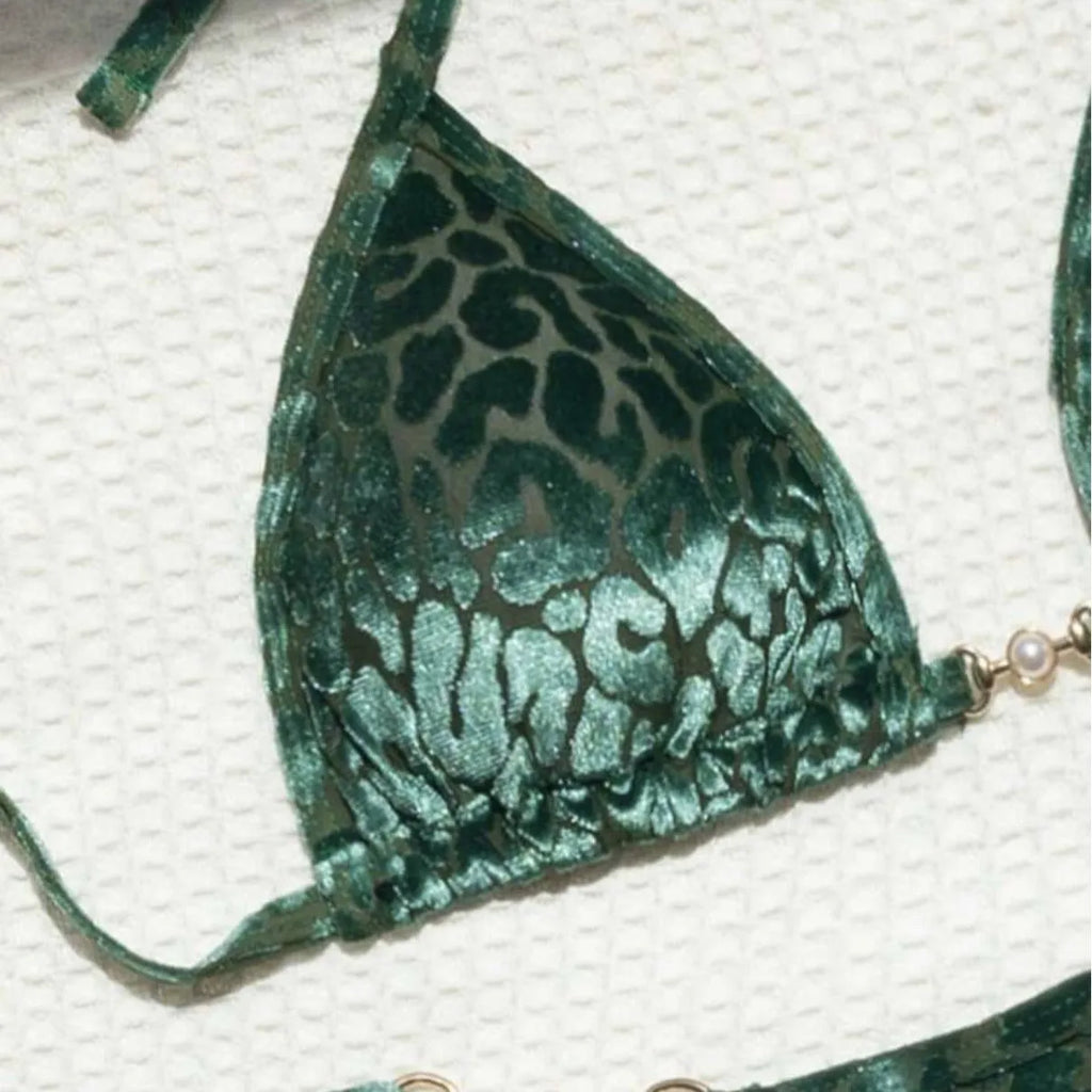 Blue leopard print women's T-shaped swimsuit bikini with spandex on a mannequin.