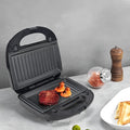Black double-sided electric sandwich maker with brushed stainless steel lid and non-stick plates