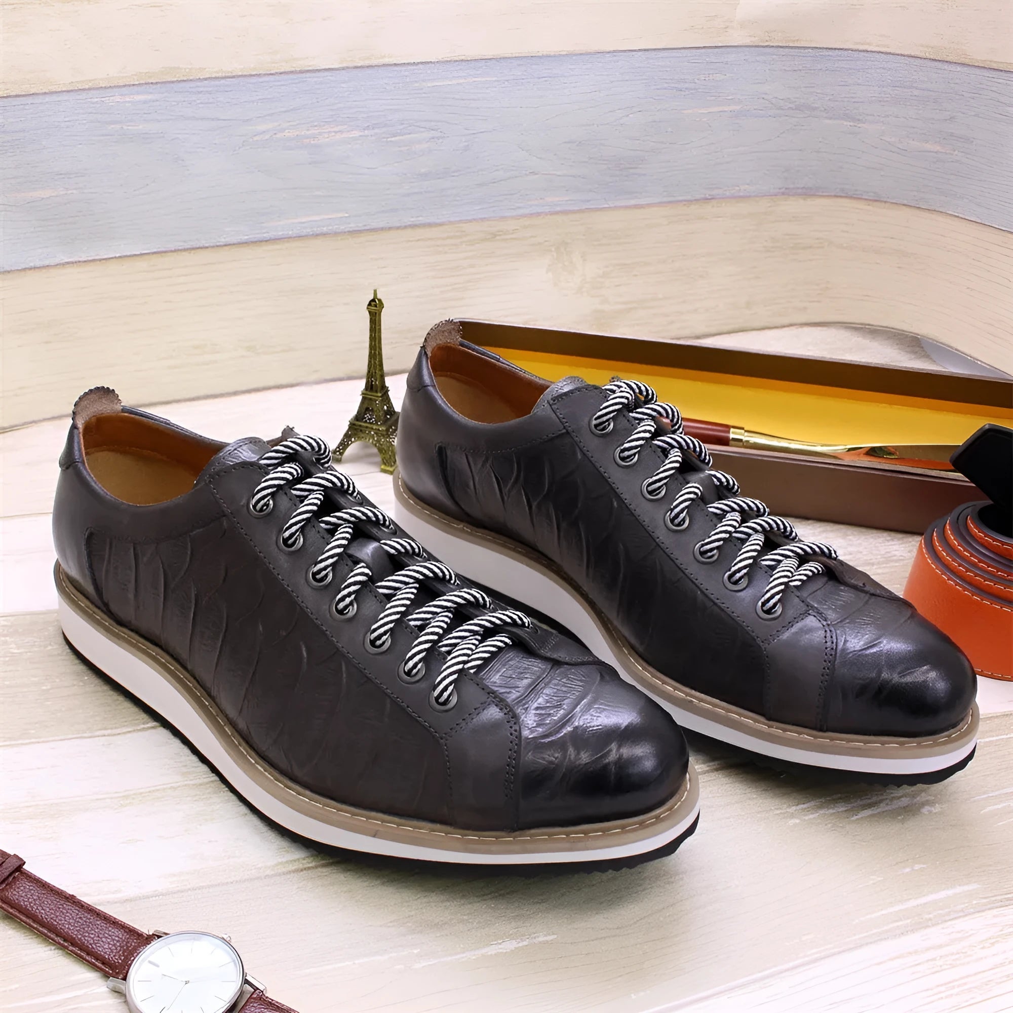 Men's low-tube casual shoes with an embossed pattern on the upper and front tie lacing.