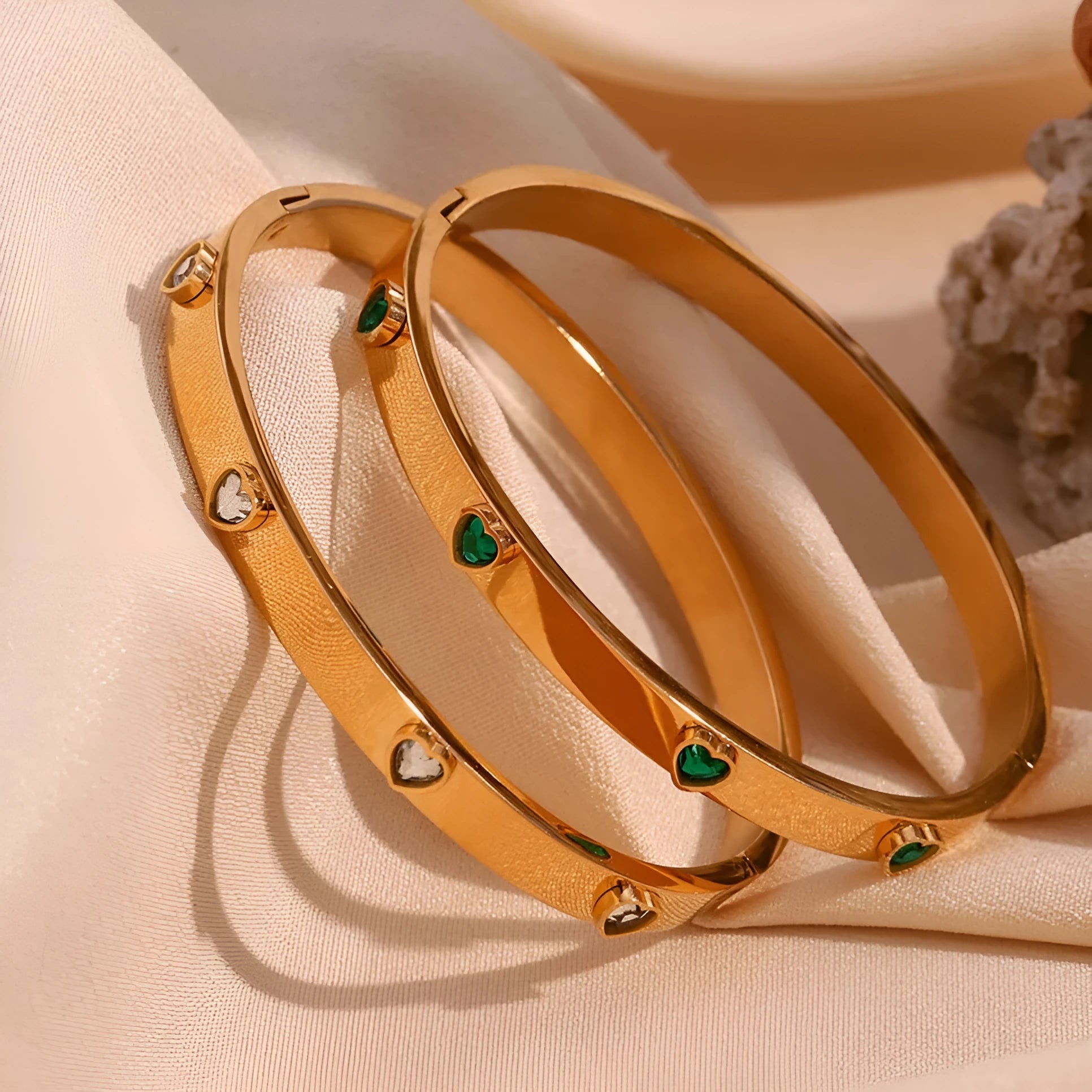Golden electroplated stainless steel bracelet with a micro-inlaid peach heart charm for women.