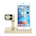 White 2 in 1 charging dock station holding an iPhone and an Apple Watch on a wooden desk.