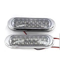 Two white car LED auxiliary lights with iron brackets and screws on a dark background