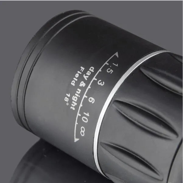 16x52 black monocular with BAK4 roof prism and green film coating on a white background