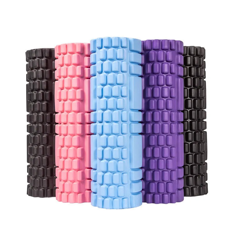 EVA foam roller in choice of colours including black, grey, pink, sky blue, and light purple on a gym floor.