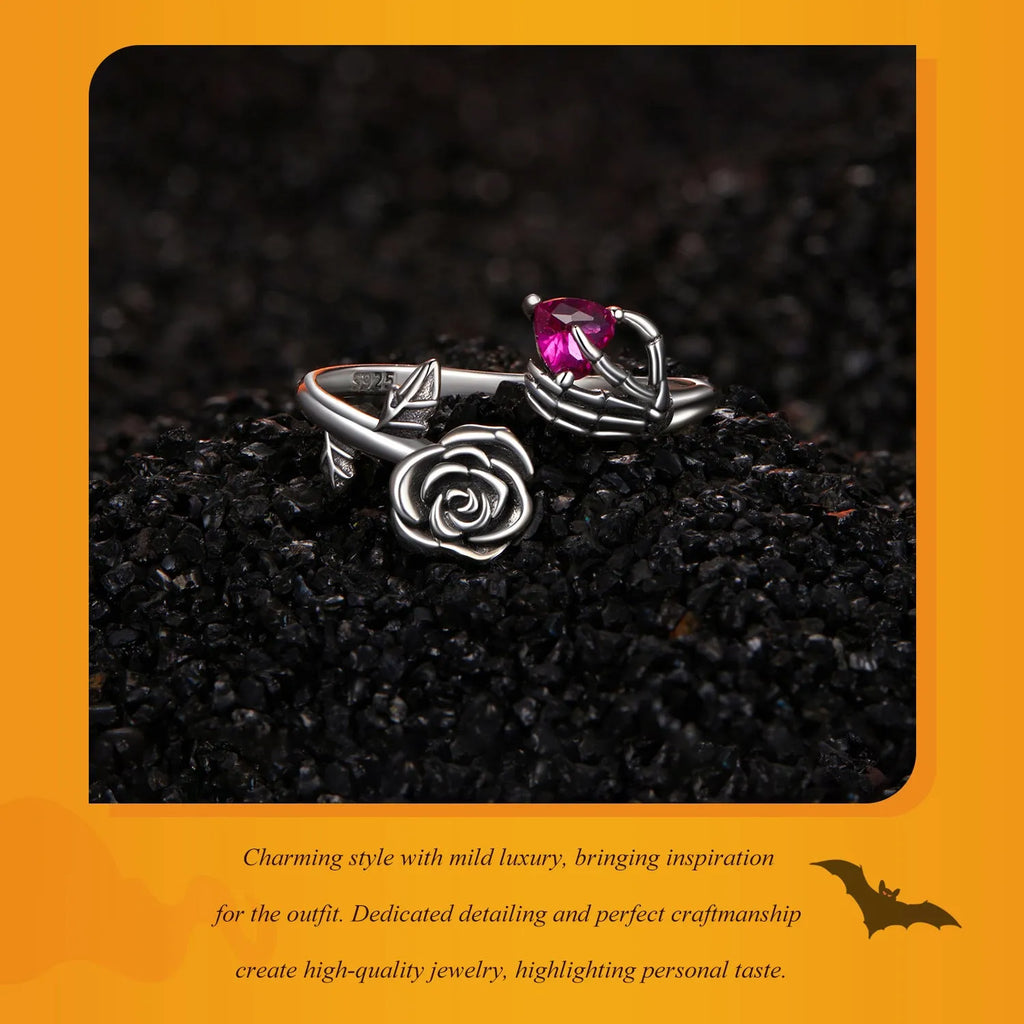 Silver Halloween rose skull hand opening ring with adjustable band on white background