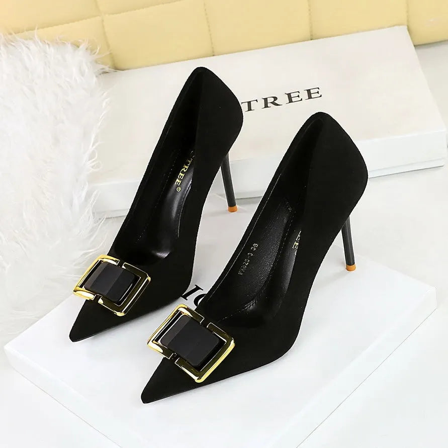 Black suede women's stiletto high heels with a 9cm heel and shallow cut, pointed toe.