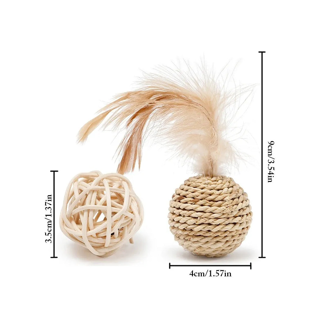 Two cat toys: hollow rattan ball and faux feather ball with bell attachment on neutral background