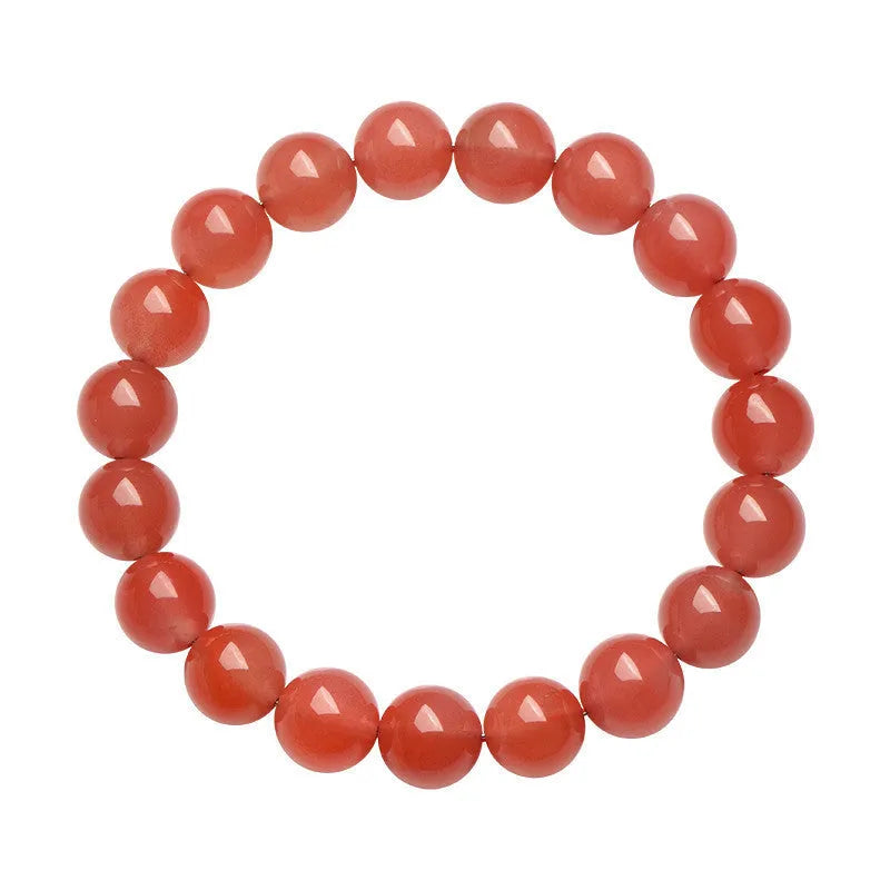 Natural South Cherry Red Agate beaded bracelet on a wrist, showing polished scattered beads on an elastic cord.