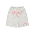 Loose cotton-blend cropped shorts in black, yellow, blue, and grey for street style.