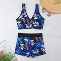 Women's two-piece printed boxer swimsuit set in a multi-colour pattern, showing sleeveless top and briefs.