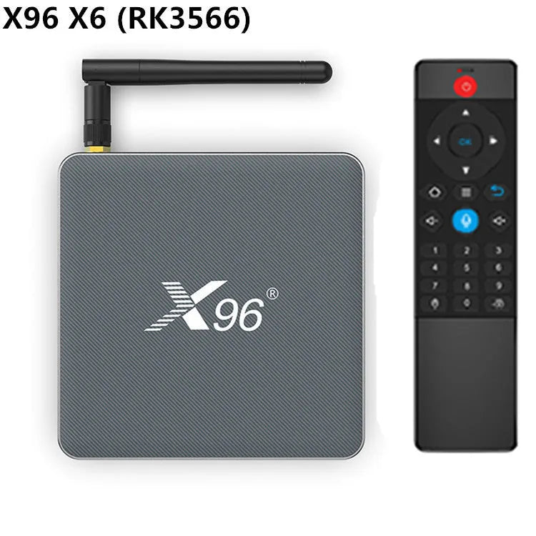 Android smart TV set-top box with remote control, HDMI cable, and power adapter on a table.