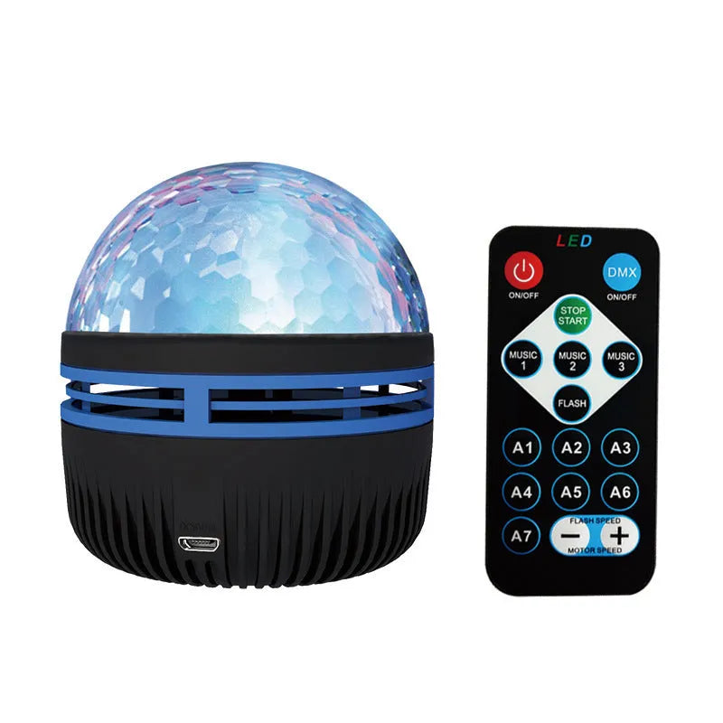 Compact LED galaxy projector night light with removable acrylic shade on a bedside table.