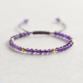 Women's crystal freshwater pearl bracelet in amethyst braided rope style on a white background
