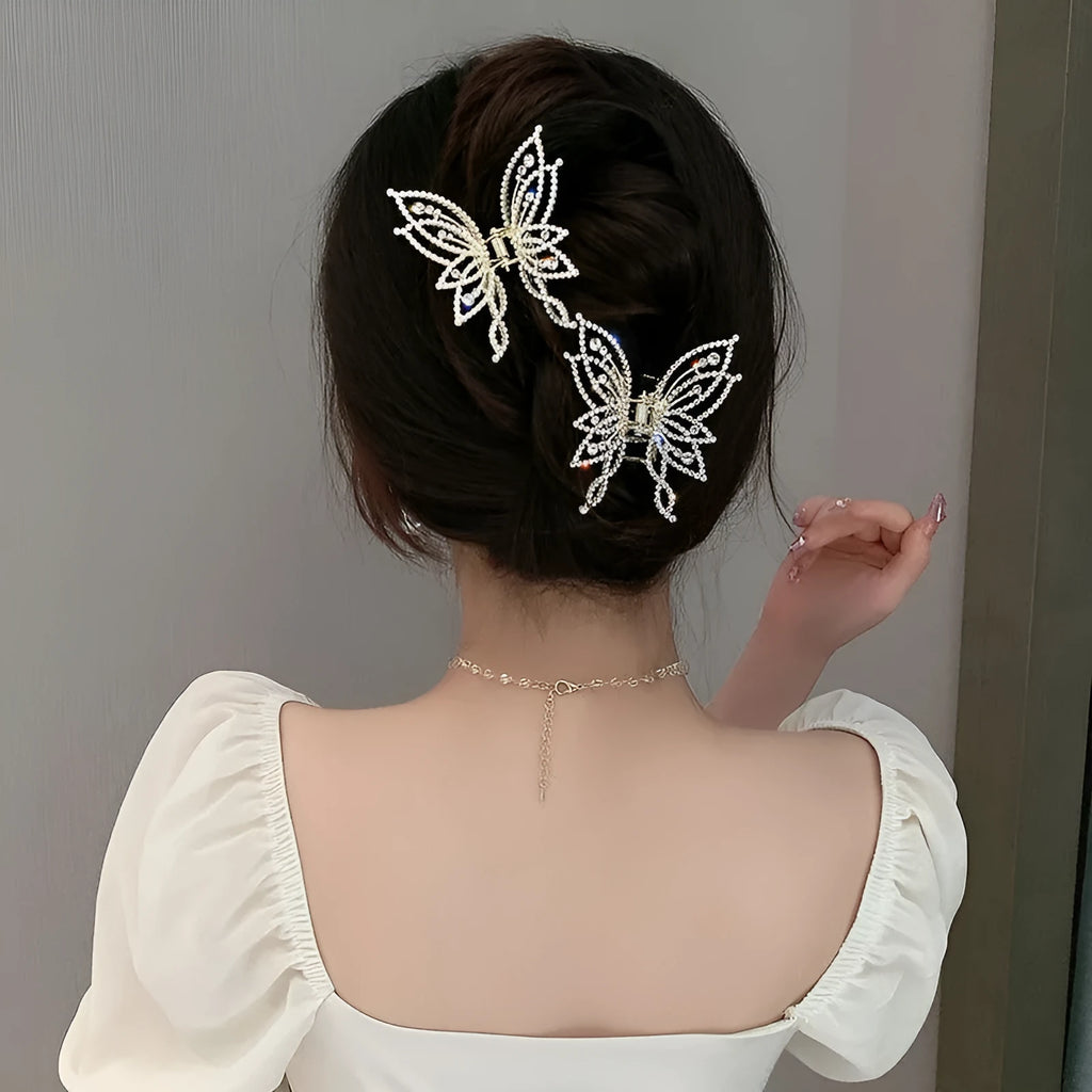 Butterfly-shaped alloy hair clip barrette for women, available in rhinestone or pearl style.