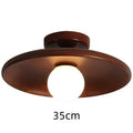 Solid wood and glass modern minimalist ceiling lamp shown in wood and walnut colours
