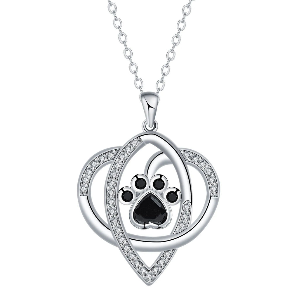 Copper necklace for women with a dog's paw print pendant on a cross chain.