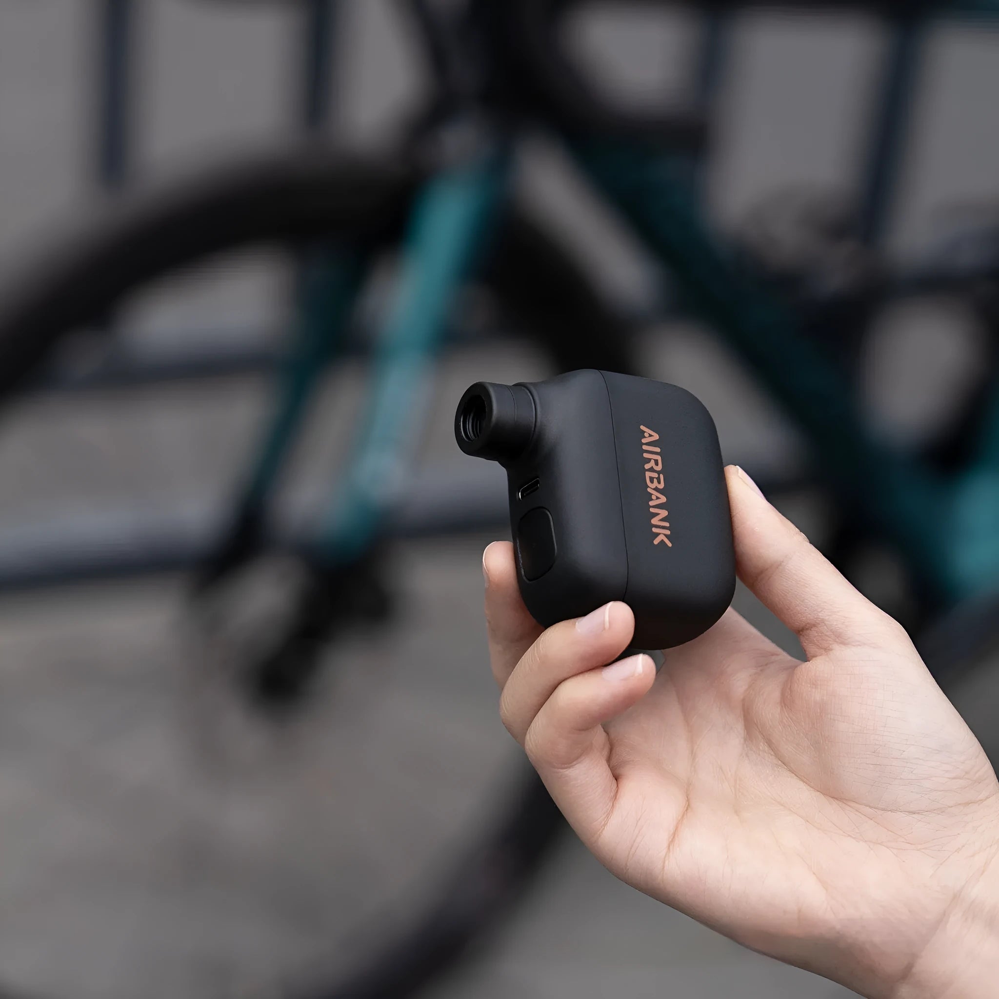 AS100 black mini electric bike pump with USB charging cable and waterproof bag