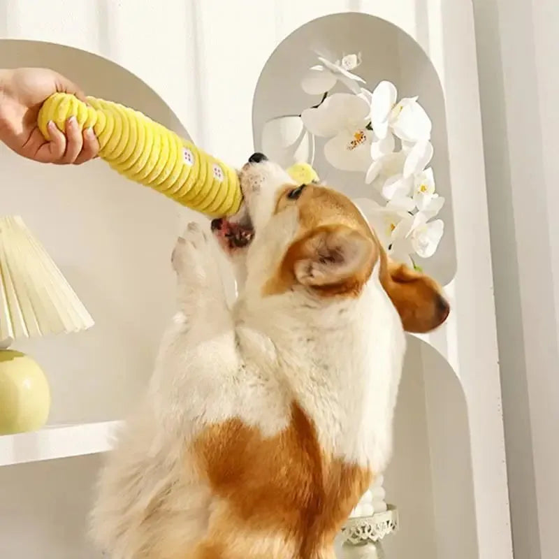 Yellow palm-shaped plush dog teething toy with squeaker for puppies