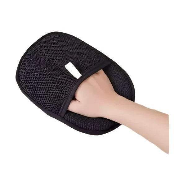 Black pet hair remover glove with silicone bristles for dogs and cats, shown on a hand