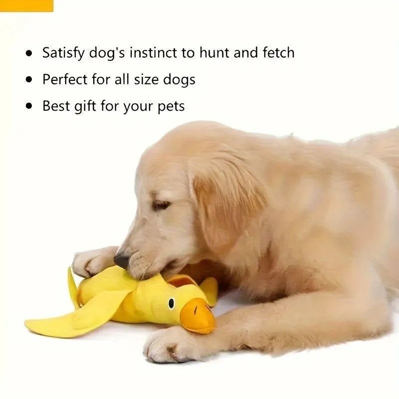 Yellow plush duck dog toy with squeaker and treat dispensing holes for training and chewing.