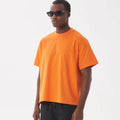 Loose-fitting pure cotton T-shirt in apricot colour showing American style cut and short sleeves