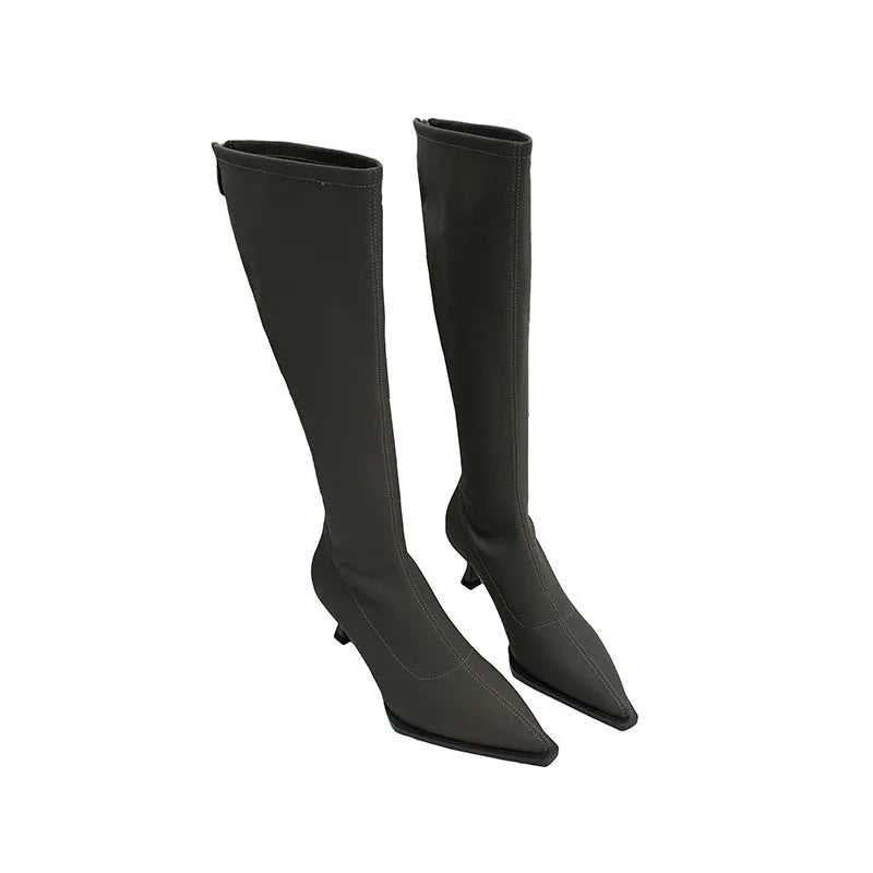 Black pointed toe women's below knee stiletto boots with a back zipper closure.