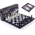 Three-in-one magnetic chess checkers backgammon board game with plastic board and ABS pieces on a table