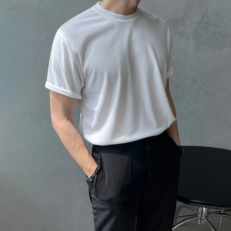 Men's slim fit cotton T-shirt in black on a hanger, showing round neck and regular sleeve.