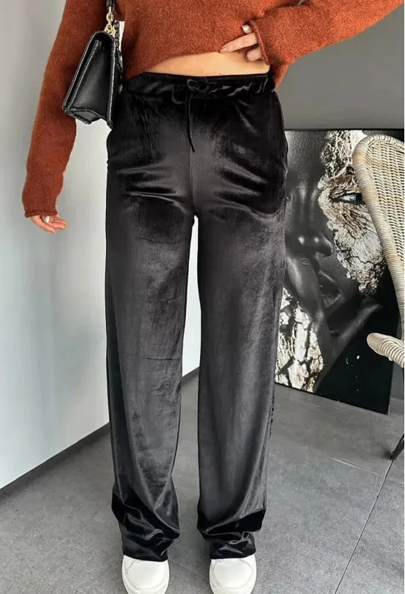 Black shiny velvet high waist drawstring straight leg casual pants on model showing full length