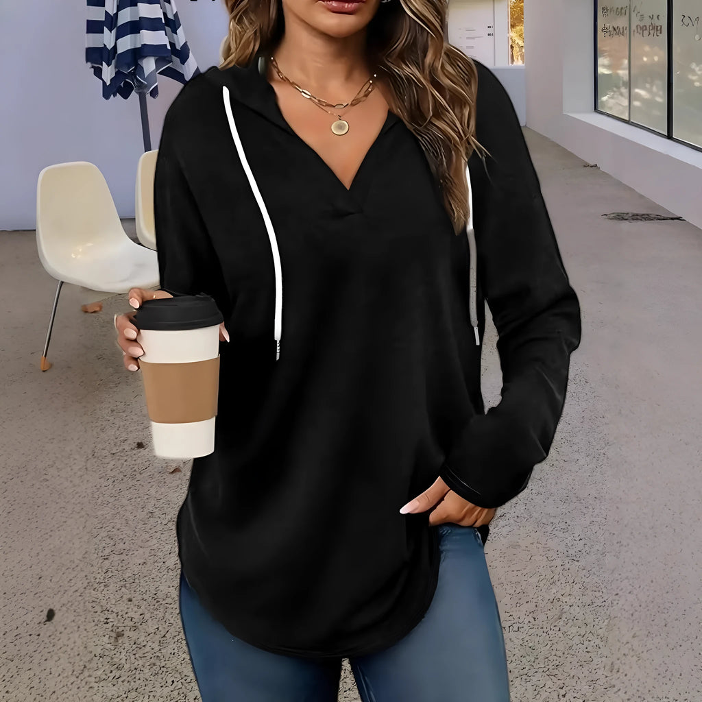 Women's red V-neck hooded sweatshirt showing front view with loose fit and regular sleeves
