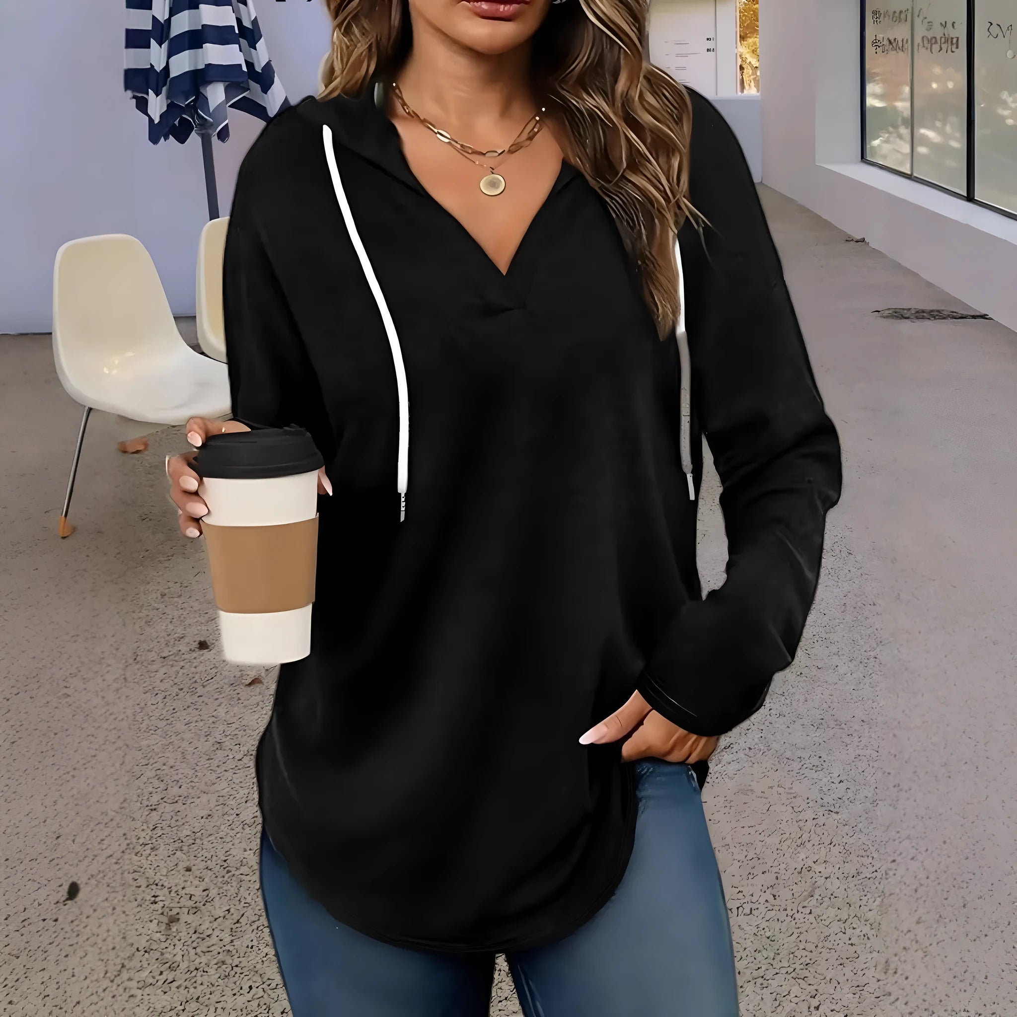 Women's red V-neck hooded sweatshirt showing front view with loose fit and regular sleeves