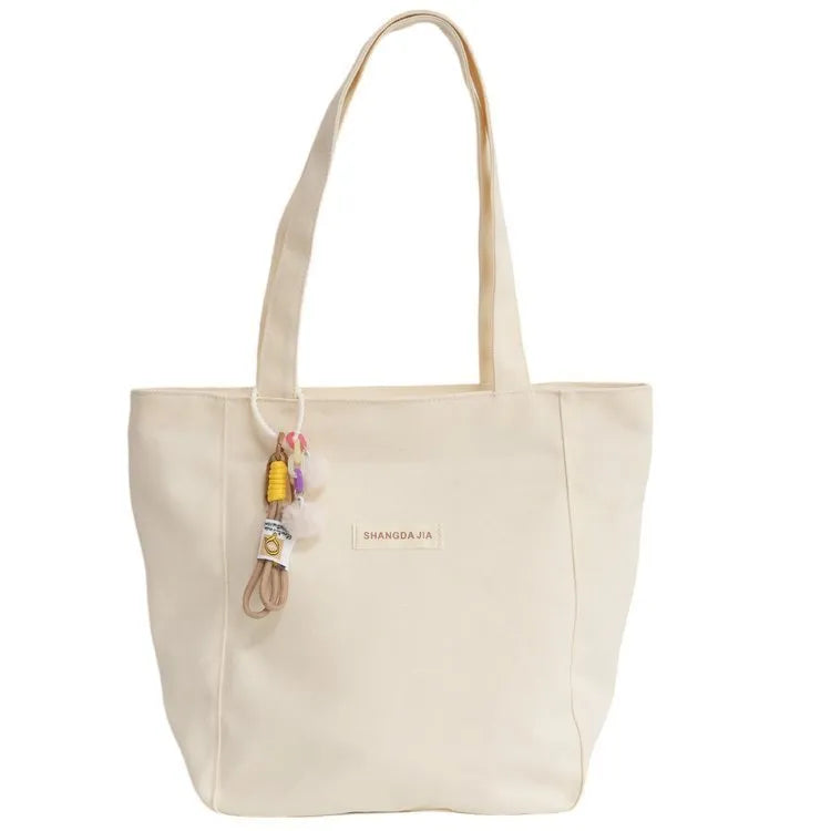 Canvas casual large capacity shoulder bag for women in four colours with pendant options