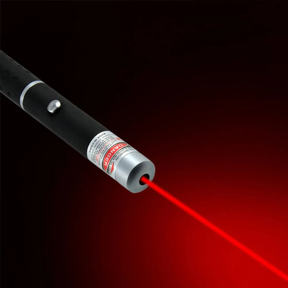 Black 5mW laser pointer pen with copper and aluminium body, red dot visible on distant surface