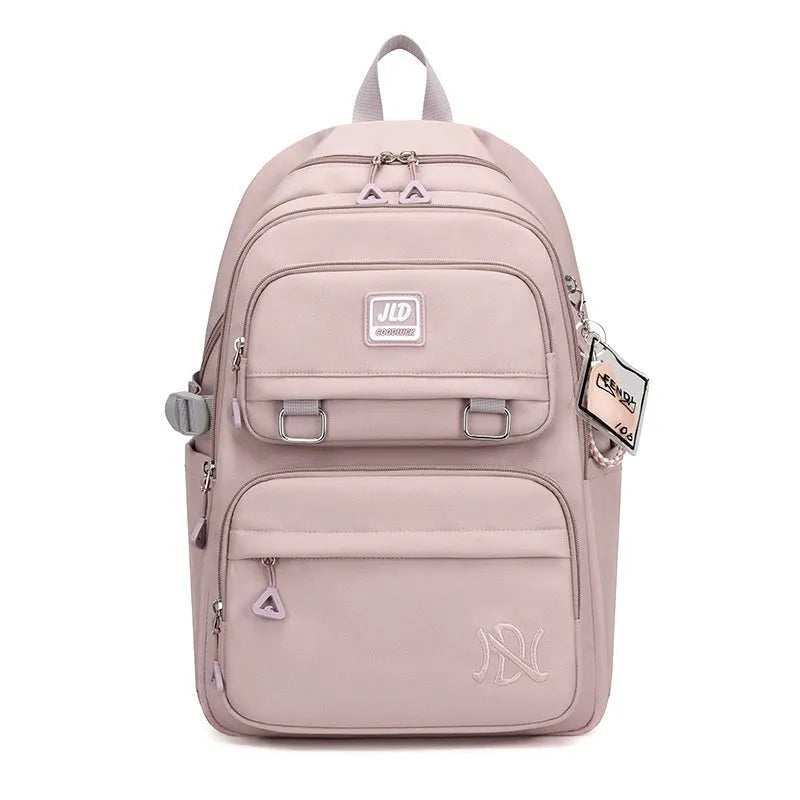 Girls' large purple and pink backpack with physiological curve backboard and geometric pattern.