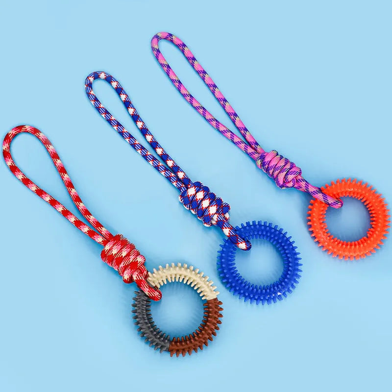 Blue braided rope dog toy with knots, shown next to a red and a rose red version for size comparison.