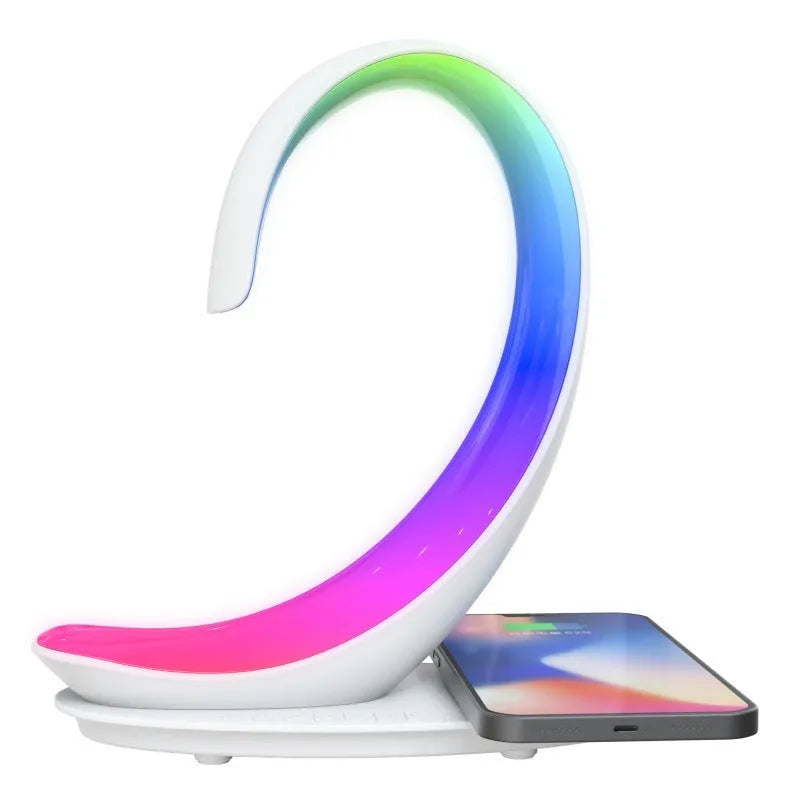 White swan-shaped desktop device with wireless charging surface, Bluetooth speaker, and colourful atmosphere lighting