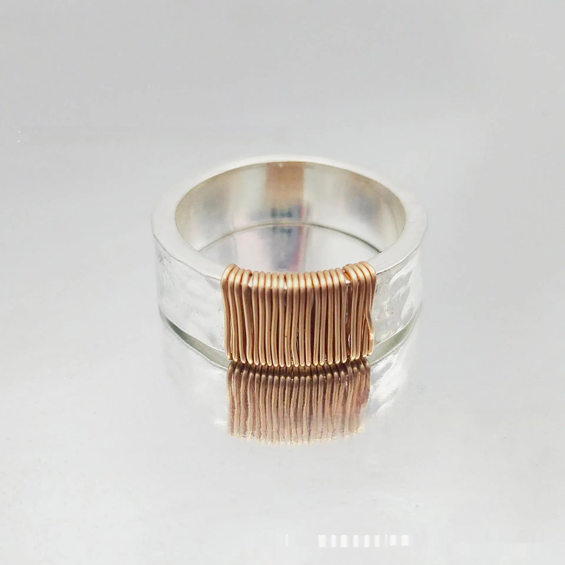 Copper simple bracelet with irregular coil geometric design and silver gold electroplated colour