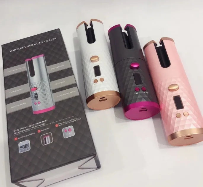 A white portable mini curling iron with a gold ceramic barrel, shown with a USB charging cable.