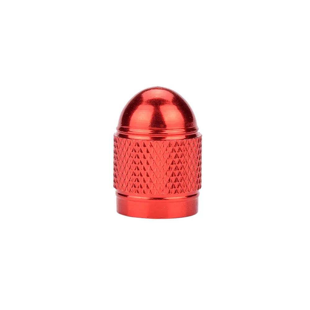 Anodised aluminium mountain bike tyre valve cap in one of five colours: black, blue, gold, red, or silver.