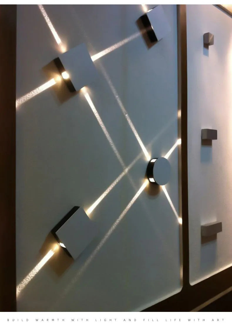 Modern square aluminium and iron LED wall light with warm white glow on a wall